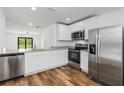 Modern kitchen featuring stainless steel appliances and granite countertops at 5373 Ulysses St, Port Charlotte, FL 33981