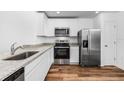 Modern kitchen with stainless steel appliances and granite countertops at 5373 Ulysses St, Port Charlotte, FL 33981