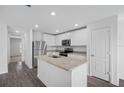 Modern kitchen with stainless steel appliances and granite countertops at 12169 Patterson Ave, Port Charlotte, FL 33981