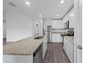 Modern kitchen with stainless steel appliances and granite countertops at 12169 Patterson Ave, Port Charlotte, FL 33981