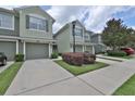 Charming townhome with a private garage and well-maintained landscaping at 2220 Kings Palace Dr, Riverview, FL 33578