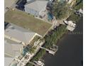 Waterfront lot with neighboring properties and boat docks at 421 Bahama Grande Blvd, Apollo Beach, FL 33572