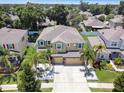 Two-story house with a landscaped yard and a two-car garage, viewed from above at 10413 Hampton Meadow Way, Riverview, FL 33578