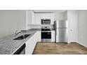 Modern kitchen with stainless steel appliances at 5401 Gillot Blvd, Port Charlotte, FL 33981