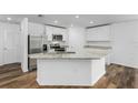 Modern kitchen with island and stainless steel appliances at 6007 Gillot Blvd, Port Charlotte, FL 33981