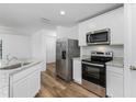 Modern kitchen featuring stainless steel appliances and granite countertops at 6007 Gillot Blvd, Port Charlotte, FL 33981