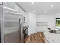 Kitchen boasts stainless steel appliances and granite countertops at 6007 Gillot Blvd, Port Charlotte, FL 33981
