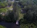 Aerial view of property with dock and surrounding mangroves at 6109 Adams St, Gibsonton, FL 33534
