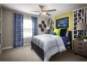 Spacious bedroom with a blue and green theme at 32112 Powderpuff Mimosa Dr, San Antonio, FL 33576