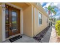 Inviting front entrance with a decorative glass door and a well-maintained exterior at 8049 Sanguinelli Rd, Land O Lakes, FL 34637