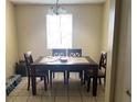 Dining room with table and chairs, ready for Gathering meals at 302 E Whitehall Ct # 111, Tampa, FL 33604