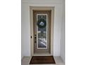 Elegant front door with glass inserts and a wreath at 16320 Hyde Manor Dr, Tampa, FL 33647
