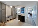 Bright entryway with built-in bench and storage at 17980 Gulf Blvd # 205, Redington Shores, FL 33708