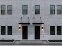 Elegant townhome entrances with sleek black doors and modern lighting at 1218 E Kay St # 10, Tampa, FL 33602
