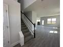 Bright entryway featuring a staircase with white railing at 7002 162Nd E Pl, Parrish, FL 34219