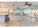 Large living area with tile floors and mirrored walls at 12945 Morris Bridge Rd, Thonotosassa, FL 33592