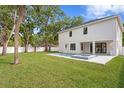 Large backyard with a private pool, spa, and white fence at 4005 W San Rafael St, Tampa, FL 33629