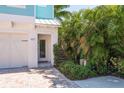 Front entrance with stairs leading up to the front door at 601 Sea Ct # 9, Dunedin, FL 34698