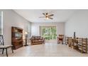 Bright living room featuring tile floors and sliding glass doors at 34841 Double Eagle Ct, Zephyrhills, FL 33541
