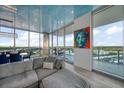 Spacious living room with city views and large windows at 5120 Marina Way # 16005, Tampa, FL 33611