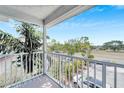 Spacious balcony with white railing, offering scenic views of the surrounding area at 1013 Apollo Beach Blvd # 202, Apollo Beach, FL 33572