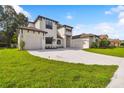 Two-story house with a modern design and a large driveway at 4327 Glendon Pl, Valrico, FL 33596