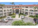 Aerial view of a large apartment building with ample parking at 2433 Brazilia Dr # 43, Clearwater, FL 33763