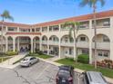 Two-story building exterior with parking in front at 2433 Brazilia Dr # 43, Clearwater, FL 33763
