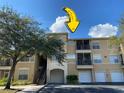 Exterior view of a three-story apartment building with parking and landscaping at 5125 Palm Springs Blvd # 9302, Tampa, FL 33647