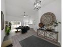 Bright living room with hardwood floors and modern decor at 1707 Tremont Ct, Sun City Center, FL 33573