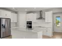 Modern kitchen with stainless steel appliances and light cabinets at 11217 Livewell Ct, Venice, FL 34293