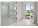 Bright and airy entryway with tile floors at 6225 Hidden Branch Dr, Apollo Beach, FL 33572