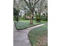 Landscaped area with walkways at 6010 Laketree Ln # L, Temple Terrace, FL 33617