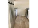 Kitchen with stainless steel appliances and wood-look flooring at 10423 Carrollbrook Cir # 201, Tampa, FL 33618