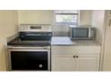 Kitchen with stainless steel appliances and granite countertops at 10423 Carrollbrook Cir # 201, Tampa, FL 33618