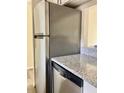 Kitchen with stainless steel appliances and granite countertops at 10423 Carrollbrook Cir # 201, Tampa, FL 33618