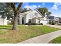 Two-story house with attached garage and lush landscaping at 2927 Minuteman Ln, Brandon, FL 33511