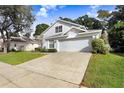 Two-story house with attached garage and a spacious driveway at 2927 Minuteman Ln, Brandon, FL 33511