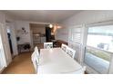 Spacious dining area with a large white table at 4851 W Gandy Blvd # B4 L32, Tampa, FL 33611