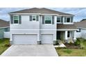 Beautiful two-story home with a three-car garage and manicured lawn in a desirable neighborhood at 11946 Brighton Knoll Loop, Riverview, FL 33579