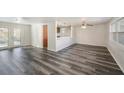 Bright living room with gray vinyl plank flooring at 4150 Hillsdale Dr, New Port Richey, FL 34652