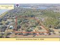 Aerial view of the property showcasing its wooded lot and proximity to recreational areas at 8529 Kenton Rd, Wesley Chapel, FL 33545