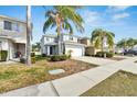 Two-story house with light blue exterior and a white garage door at 12950 Fennway Ridge Dr, Riverview, FL 33579