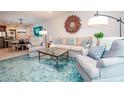 Open living room with comfortable seating and modern decor at 29130 Bay Hollow Dr # 3309, Wesley Chapel, FL 33543