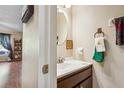 Small half bathroom with vanity, sink, and mirror at 2923 W Gandy Blvd, Tampa, FL 33611