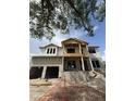 New two-story home under construction, featuring a spacious design and covered entryway at 567 Luzon Ave, Tampa, FL 33606