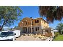 New two-story home under construction, showing the block foundation and wood framing with a worker on the roof at 567 Luzon Ave, Tampa, FL 33606