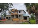 New two-story home under construction featuring a spacious layout and attached two-car garage at 567 Luzon Ave, Tampa, FL 33606