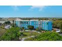 Blue building aerial view, showing surrounding landscape and parking at 3315 58Th S Ave # 306, St Petersburg, FL 33712