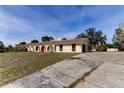 Ranch-style home with large yard and driveway at 7820 Sycamore Dr, New Port Richey, FL 34654